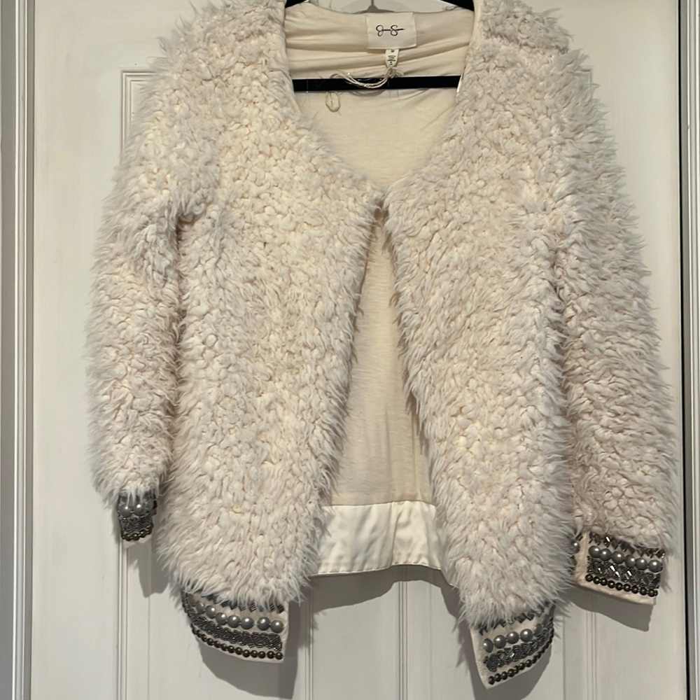Funky jacket with intricate beading in sleeves and around the waste